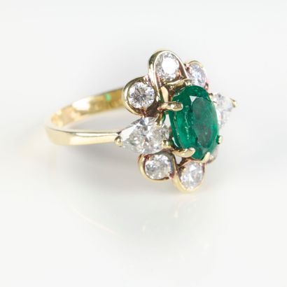 Yellow gold ring set with an oval emerald...