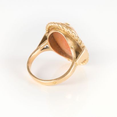 Gold ring set with a shell cameo engraved...