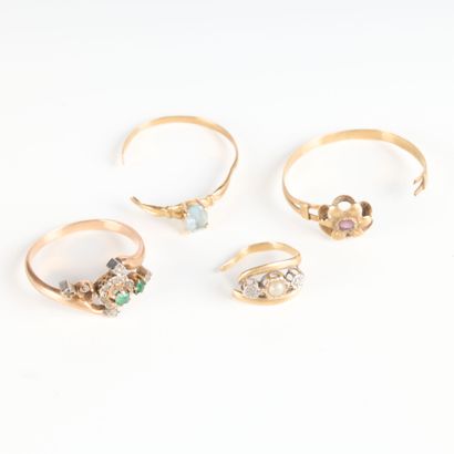 4 gold rings set with small stones and pearls....