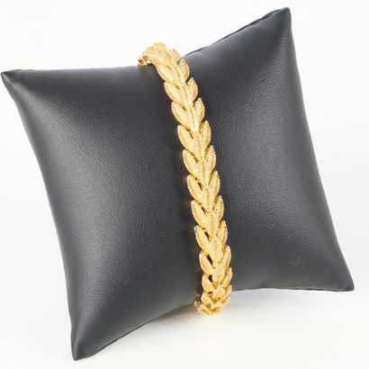 Articulated gold bracelet with amati foliage...
