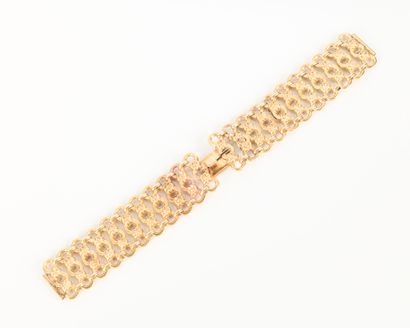 Openwork gold watchband decorated with interlaced...