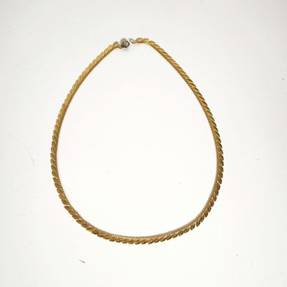 Rose gold necklace featuring an interlaced...