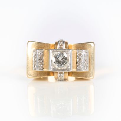 A striking tank-style ring in gold and platinum,...