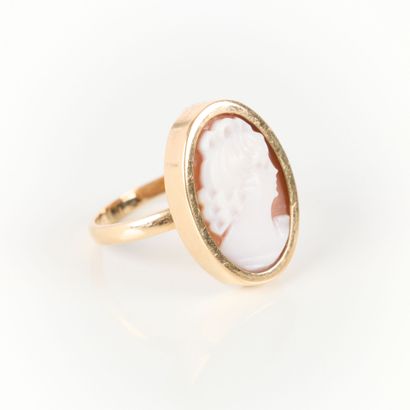 Gold ring set with a shell cameo engraved...