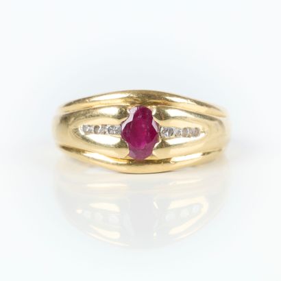 Gold ring set with an oval-cut ruby and 6...