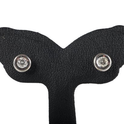 Pair of white gold stud earrings each set...