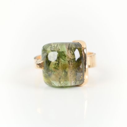 Contemporary gold ring set with a fine cabochon...