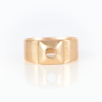 Gold ring with square motif. Stone missing....