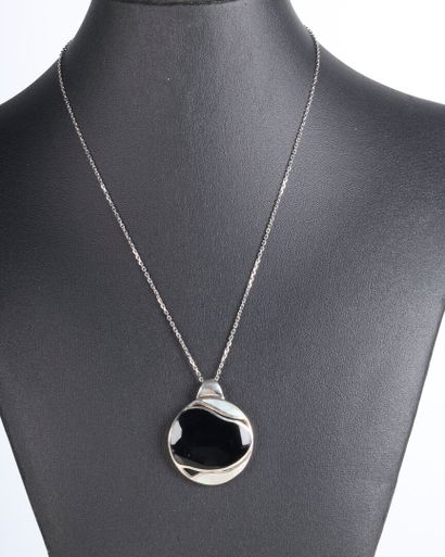 Solid silver pendant set with a stylized-cut...