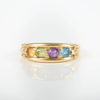 Gold band ring set with 4 oval gemstones....