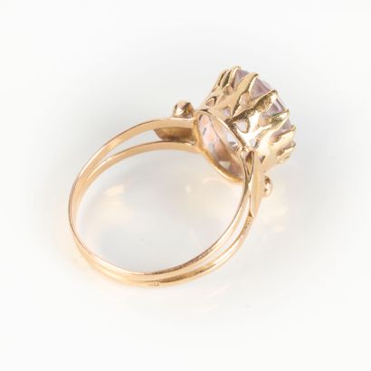 Rose gold ring set with an oval blue semi-precious...