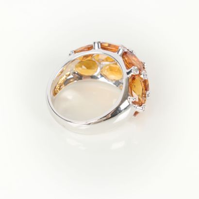 White gold (750‰) band ring paved with citrines...
