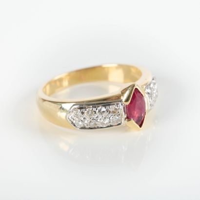 Two-tone gold ring set with a navette ruby...