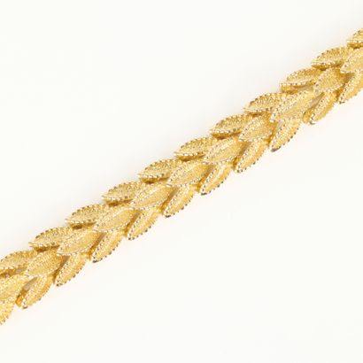 Articulated gold bracelet with amati foliage...