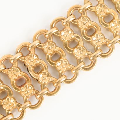 Openwork gold watchband decorated with interlaced...