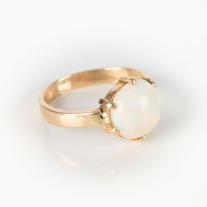 Rose gold ring set with a round cabochon...