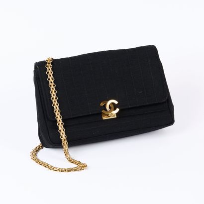 CHANEL. Black jersey handbag, vertical and...