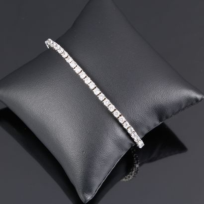 Line bracelet in silver set with white stones....