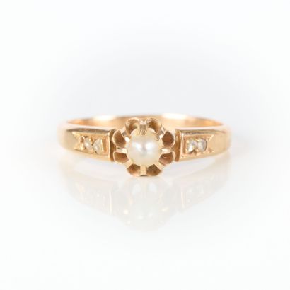 Pink gold ring set with a half-pearl and...