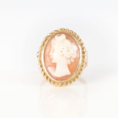 Gold ring set with a shell cameo engraved...