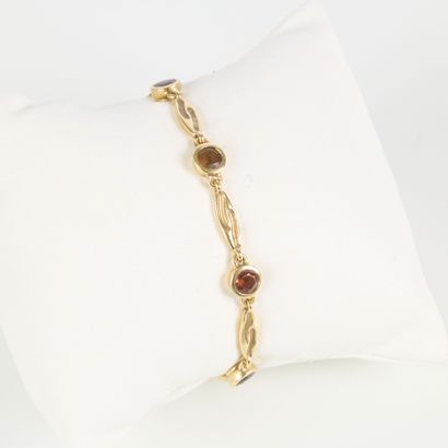 Gold bracelet set with 7 gemstones (topaz?...