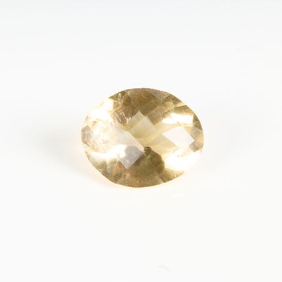 Oval faceted citrine on paper: weighing approx....