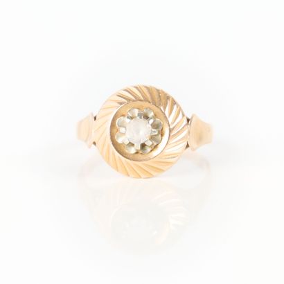 Two-tone gold ring set with a white stone....