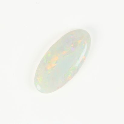 An oval cabochon opal weighing 6 cts (2.33...