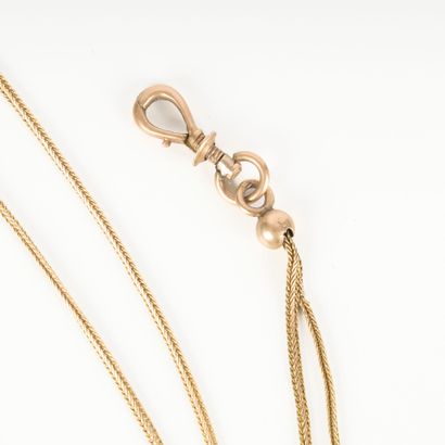 Long necklace in two-tone gold, braided mesh....