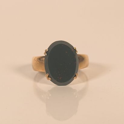 Rose gold ring set with an oval blood jasper...