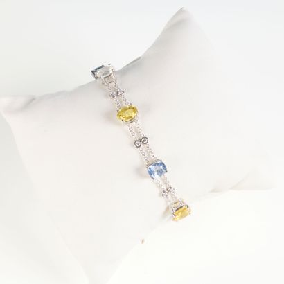 White gold bracelet set with seven yellow,...