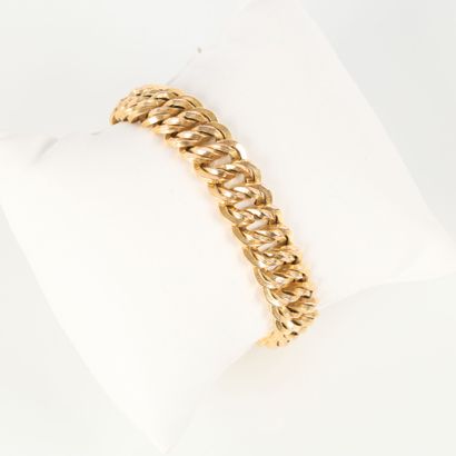 American-style gold curb chain, holding a...