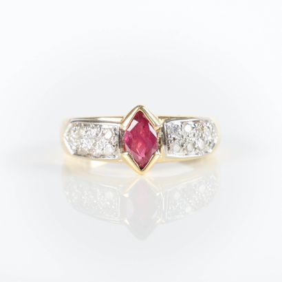 Two-tone gold ring set with a navette ruby...
