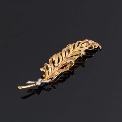 BOUCHERON. Two-tone gold feather brooch set...