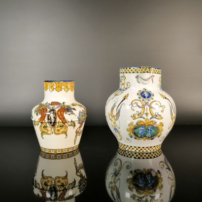 GIEN. Set of two polychrome earthenware pitchers...