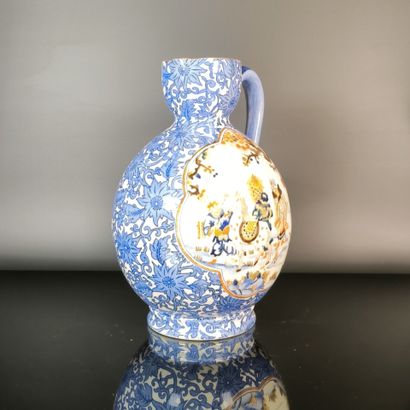 GIEN
Polychrome earthenware pitcher decorated...