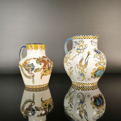 GIEN. Set of two polychrome earthenware pitchers...