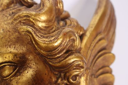 Terracotta piece decorated with a cherub's...
