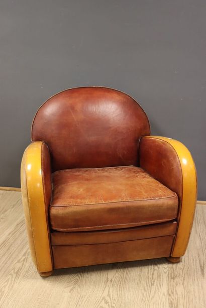 Leather and wood club chair 
H. 80 x W. 80...