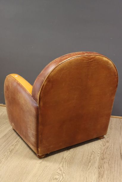 Leather and wood club chair 
H. 80 x W. 80...