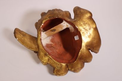 Terracotta piece decorated with a cherub's...