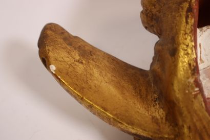 Terracotta piece decorated with a cherub's...
