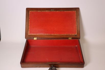 A veneered wooden writing desk with light-colored...