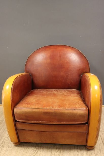 Leather and wood club chair 
H. 80 x W. 80...