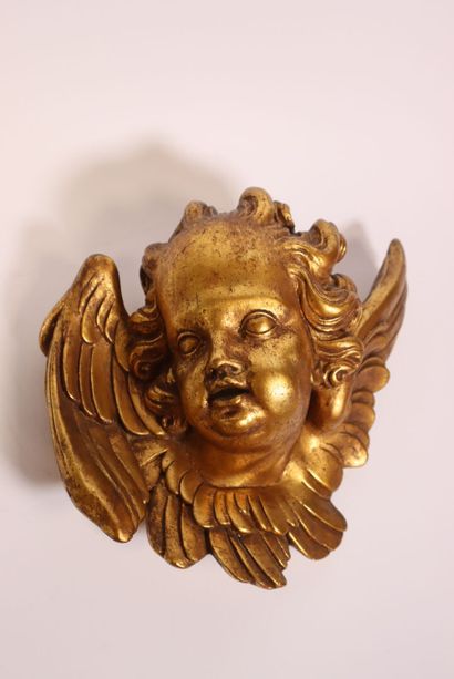 Terracotta piece decorated with a cherub's...