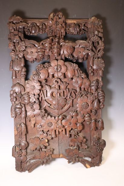 Carved wood panel decorated with flowers,...