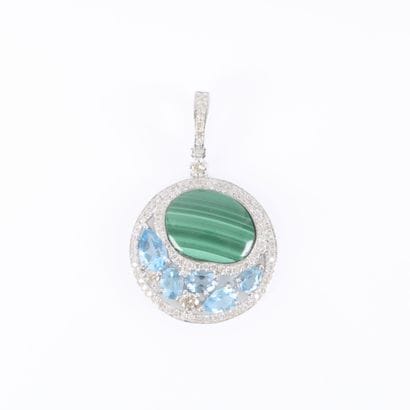 Round white gold pendant featuring a circular...