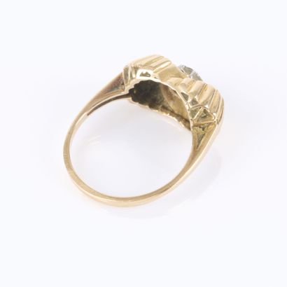 Gold ring with a crisscrossed fluted design,...