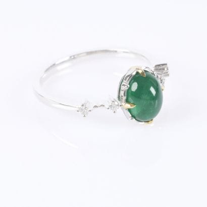 White gold ring set with an oval cabochon...