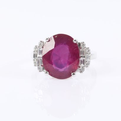White gold ring set with a treated oval-cut...